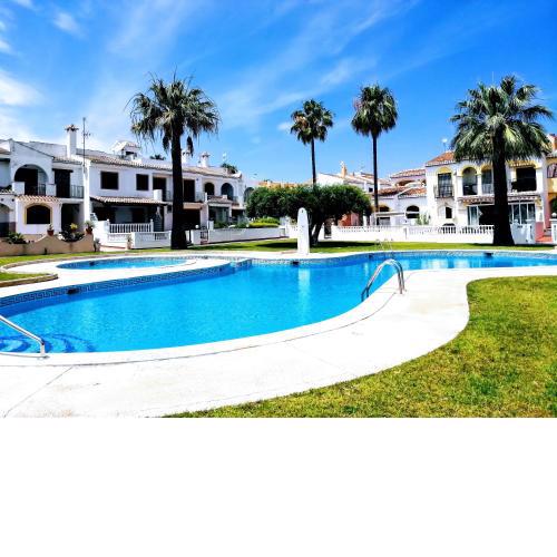 2 bedrooms house with shared pool furnished garden and wifi at Torrevieja 1 km away from the beach
