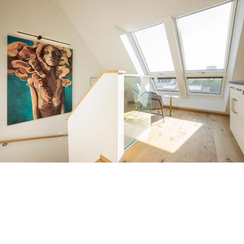2-story penthouse with designer renovation for 2 people. A 15-minute walk to the city center