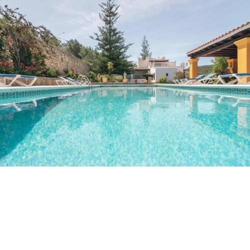 4 bedrooms villa with private pool jacuzzi and furnished garden at Santa Eularia des Riu