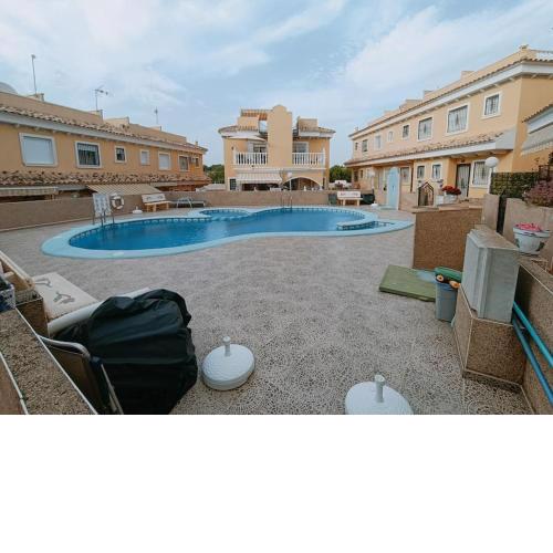 A delightful 2 bed family house with communal pool