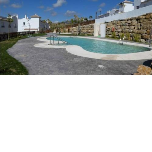 Agradable casa adosada con piscina