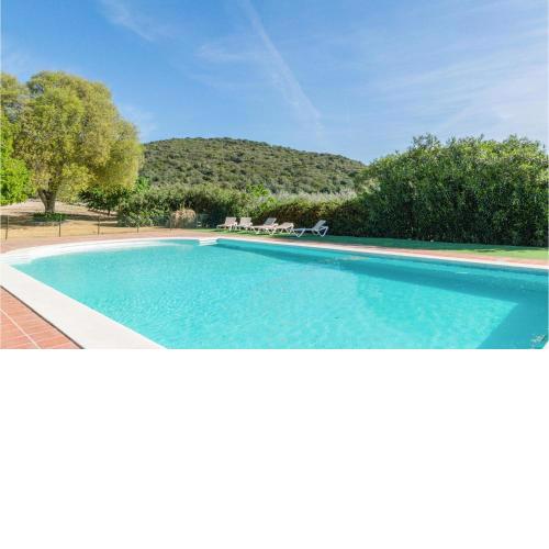 Amazing home in Lora del Rio with Outdoor swimming pool, WiFi and 3 Bedrooms