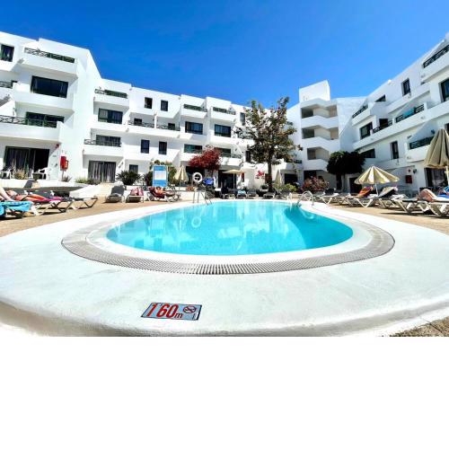 Apartamento con Wifi, piscina, junto al mar en Playa Puerto del Carmen