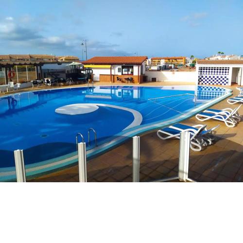 Apartment with sunny terrace and swimming pool