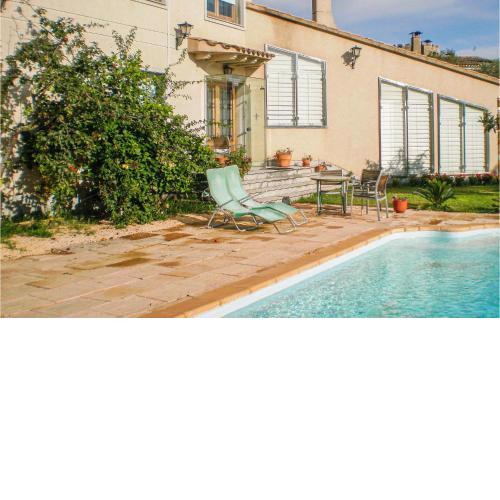 Awesome home in Santa Cristina dAro with 4 Bedrooms, WiFi and Outdoor swimming pool