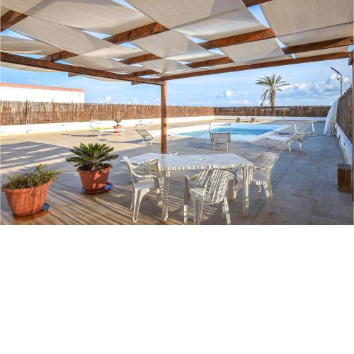 Beautiful home in Portopalo di C,P, with 4 Bedrooms, WiFi and Outdoor swimming pool