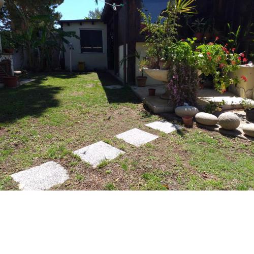 Brezza di mare appartamento in Villa con giardino e spiaggia ,casa vacanze al mare