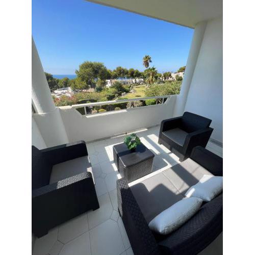 Bright apartment with amazing terrace overlooking the garden and sea, 2 bedrooms, sleeps 4, swimming pool and gardens in a very quiet area