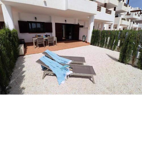 Casa de Femmie apartamento de lujo terraza jardín y piscina comunitaria