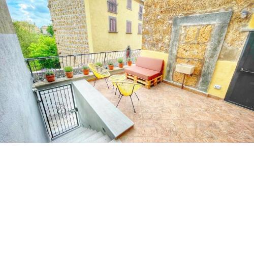 Casa del Glicine - monolocale con terrazzo vista sul verde, self check-in e parcheggio gratuito