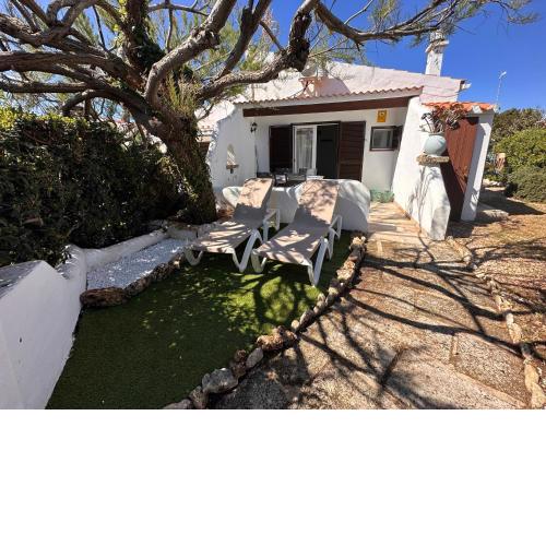 Casa turística y acogedora con piscina y jardín en Cap d Artrutx para 4 personas
