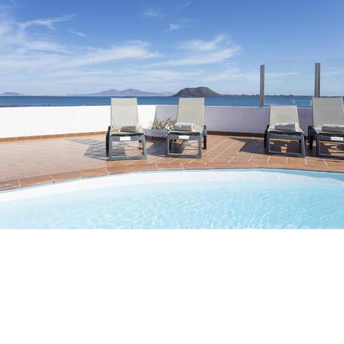 Corralejo Beachfront Villa Remos with Lobos Island View, Private Pool, Wifi & BBQ by Amazzzing Travel