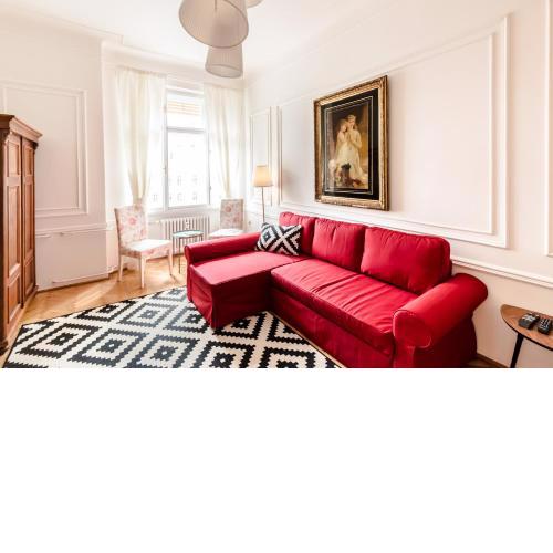 Golden Esthetic with Red Sofa Apartment