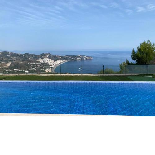 Half of the luxury villa with sea view and pool in natural park