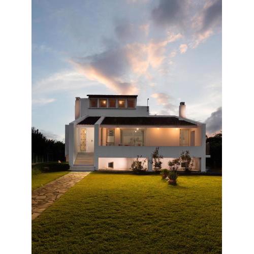 Holiday home next to orange tree orchard