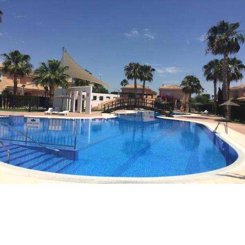 House sleeps 6, large pool walk to beach