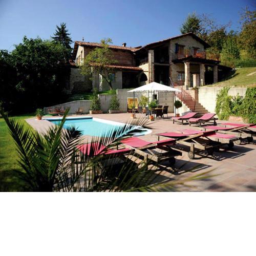House with large terrace in a small residence with swimming pool surrounded by greenery