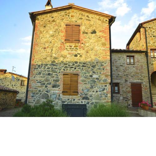 In a wonderful medieval village on the Tuscan hills, with air conditioning
