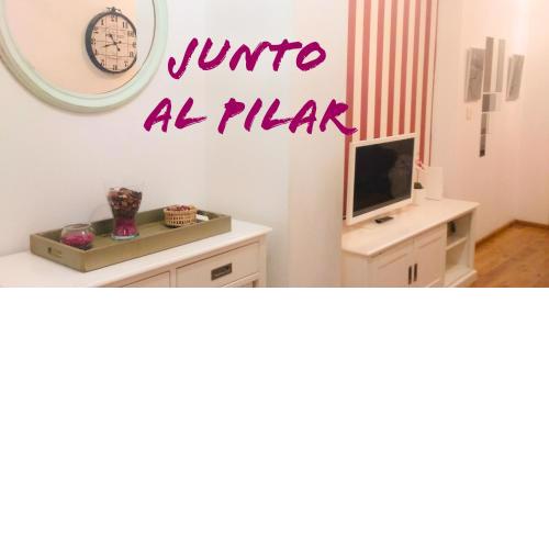 JUNTO AL PILAR