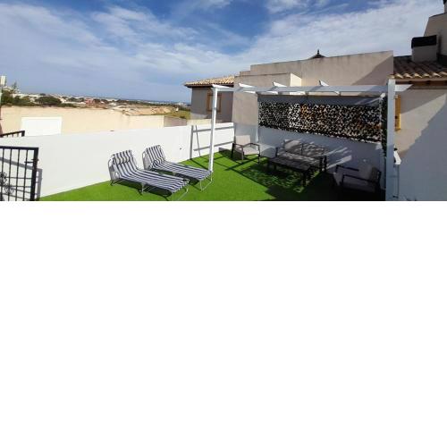 Lomas de Cabo Roig Top floor apartment with private roof Solarium Airport Runs Included