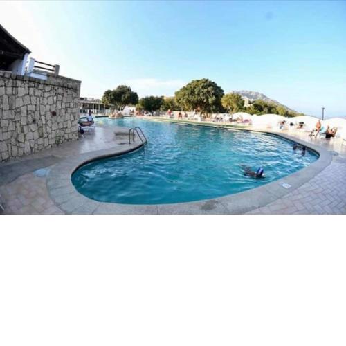 Monolocale Arianna con giardino privato e piscina