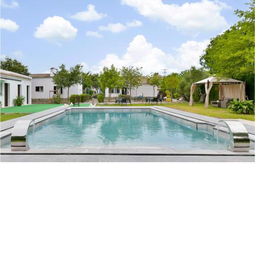 Nice home in El Coronil with Outdoor swimming pool, WiFi and 2 Bedrooms