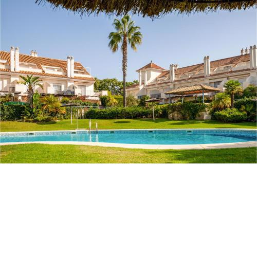 Nice home in Nuevo Portil with Outdoor swimming pool and 3 Bedrooms