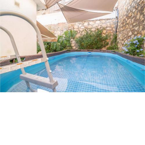 Nice home in Rincon de la Victoria with Outdoor swimming pool, Swimming pool and 3 Bedrooms