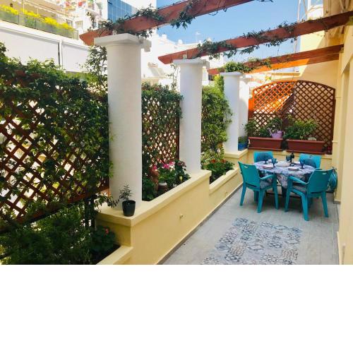 Oasis veranda under columns.Kolonaki embassy area.