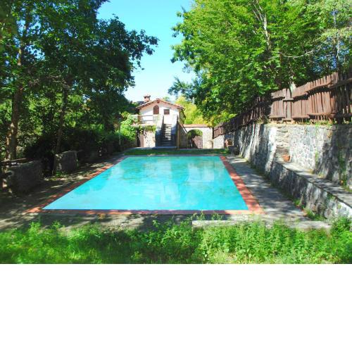Old estate with all adorable holiday houses in the wooded hills with shared pool