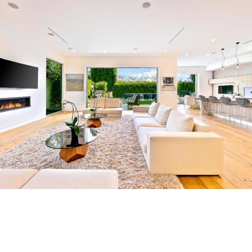 On the ground floor you will find the living room with big windows