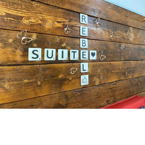 REBEL SUITE SRL