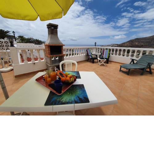 Rooftop sun lounge with ocean views
