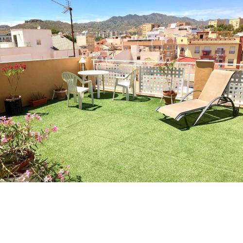 Room with single bed in typical townhouse with rooftop terrace