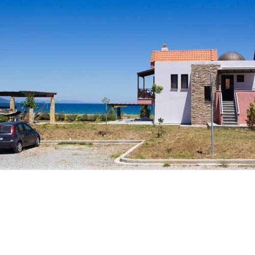 Seafront house with garden