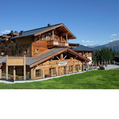 Snow covered elevated homes on the border of Salzburgerland
