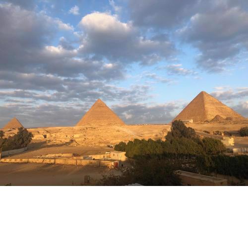 Sphinx palace pyramids view