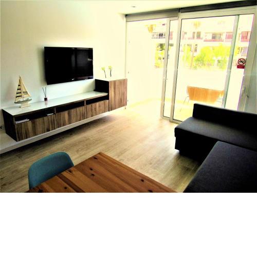 Spotless south facing apartment with pool view and WIFI heart of Las Americas
