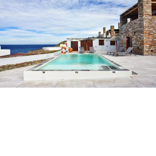 Stone villa with a sea water swimming pool and a sea and sunset view