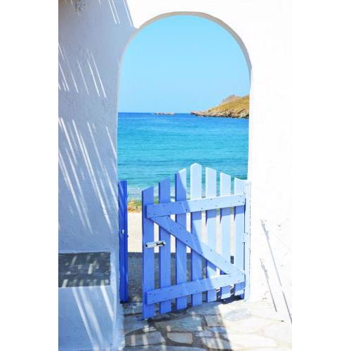 Traditional house on the beach front in the area of Otzia, Kea