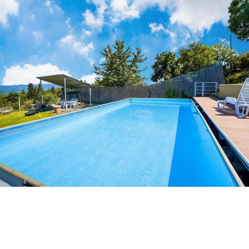 Villa with above ground swimming pool in the rolling Tuscan hills with a beautiful view